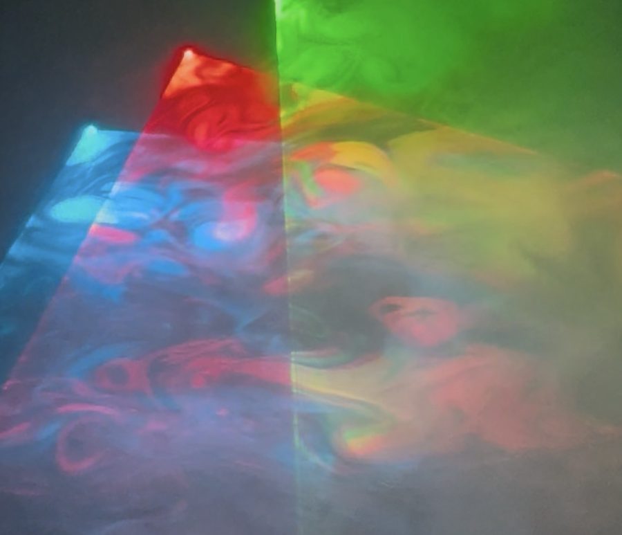 Blue, red and green laser fans over a fog bank
