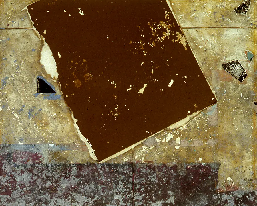 Abstract work with a large tilted brown shape over an ochre and cream field and a mauve band at the base.